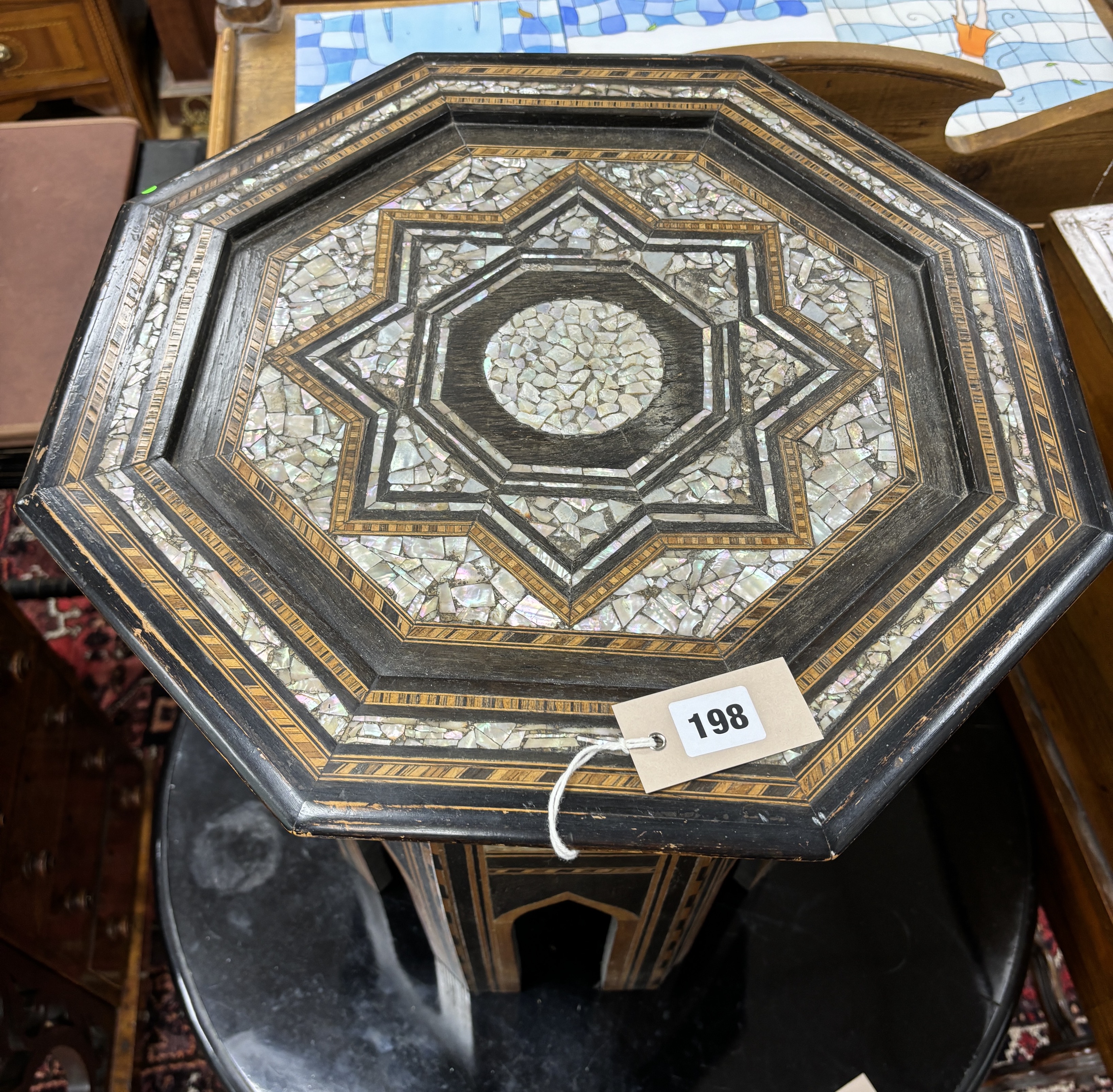A Moorish octagonal mother of pearl inlaid occasional table, width 46cm, height 51cm